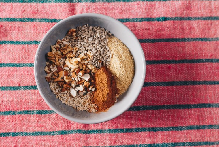 nuts and seeds with spices in a white bowl