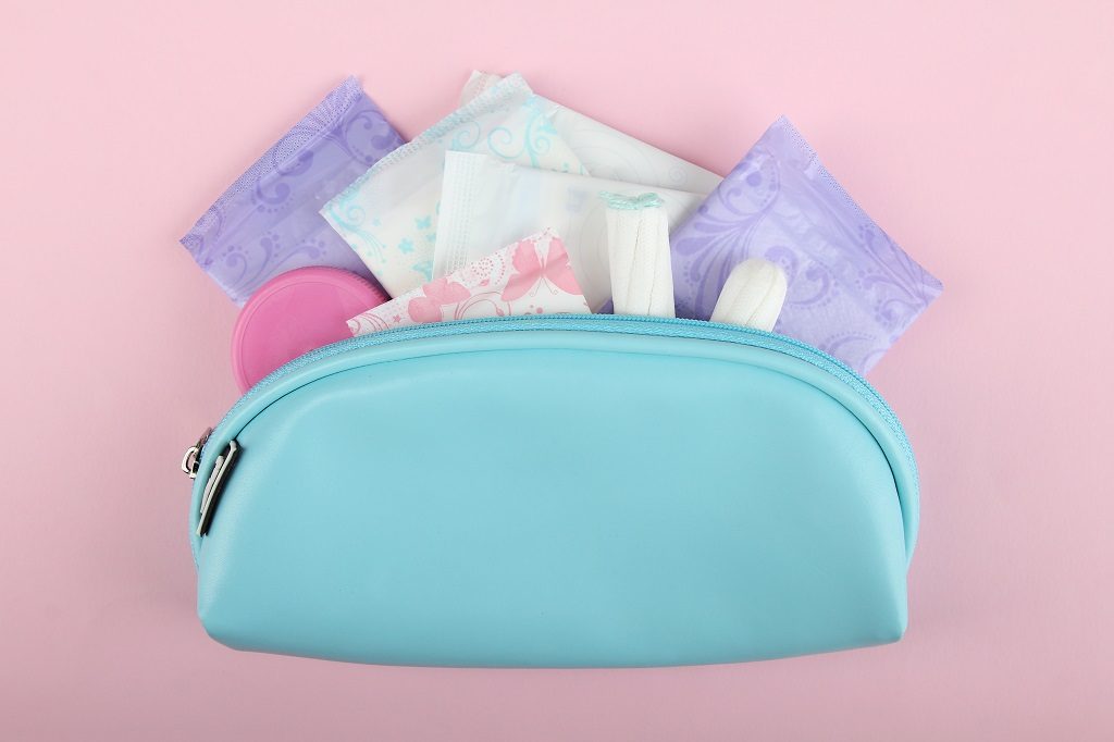 feminine hygiene products in blue pouch
