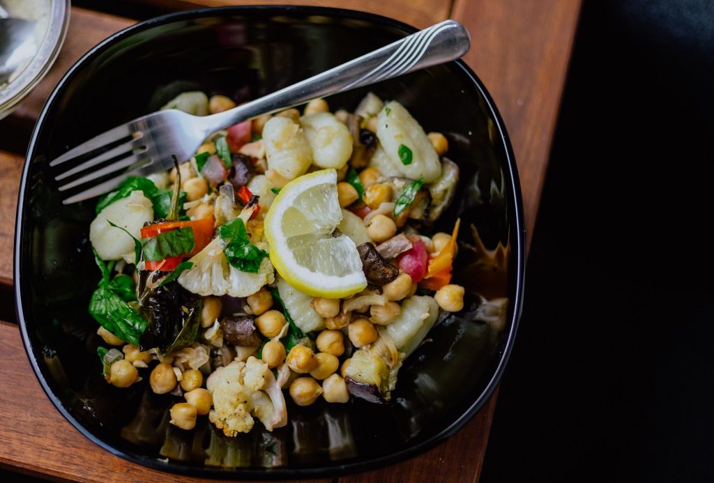 chickpea and roasted vegetables salad with lemon slice