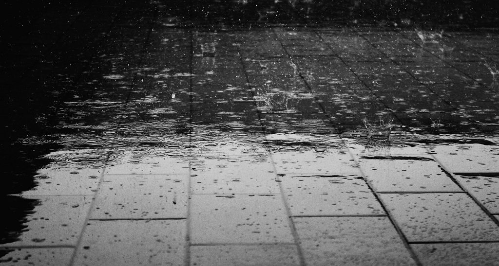 rain falling on pavement