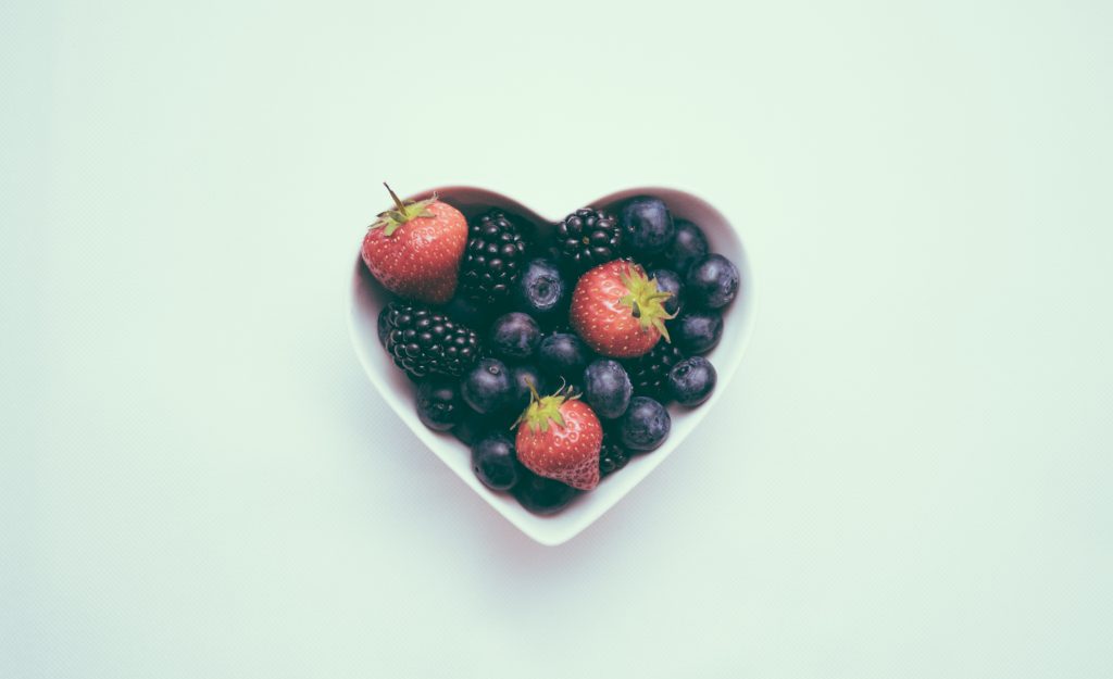 A heart-shaped bowl of heart-healthy berries 